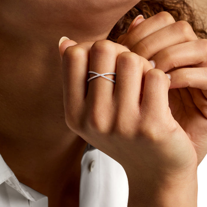 Sterling silver crisscross diamond ring on a hand
