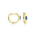 14kt yellow gold huggie hoops with blue sapphire stones