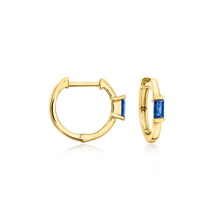 14kt yellow gold huggie hoops with blue sapphire stones