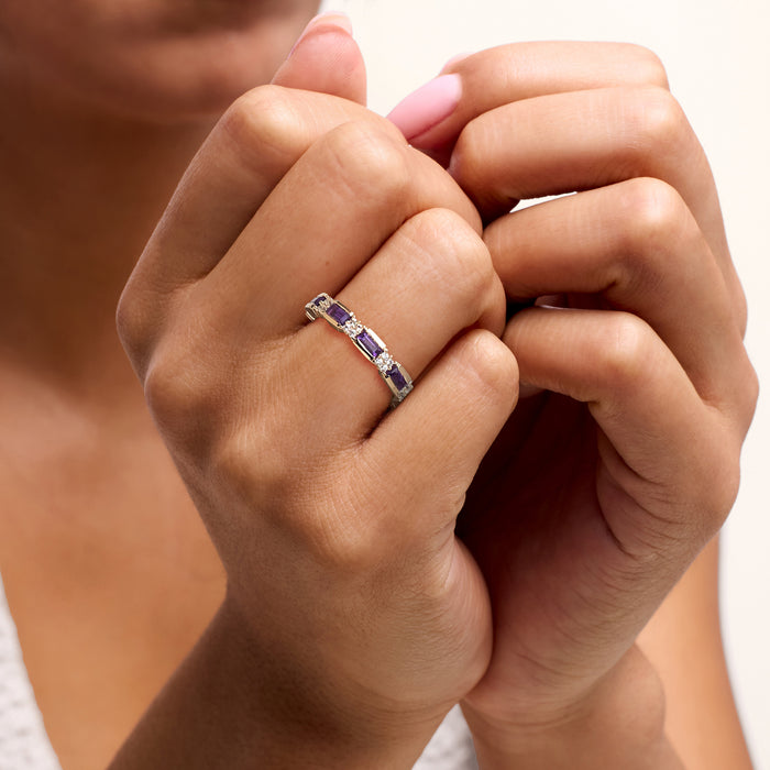 Amethyst and white zircon eternity band on finger, 18kt gold over sterling, purple stones