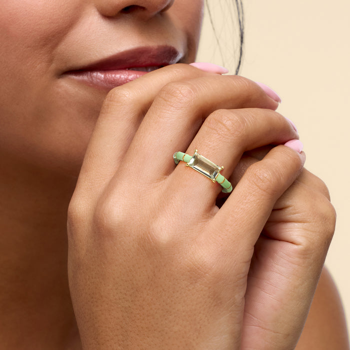 Green enamel and gold-tone ring with emerald-cut pale green stone