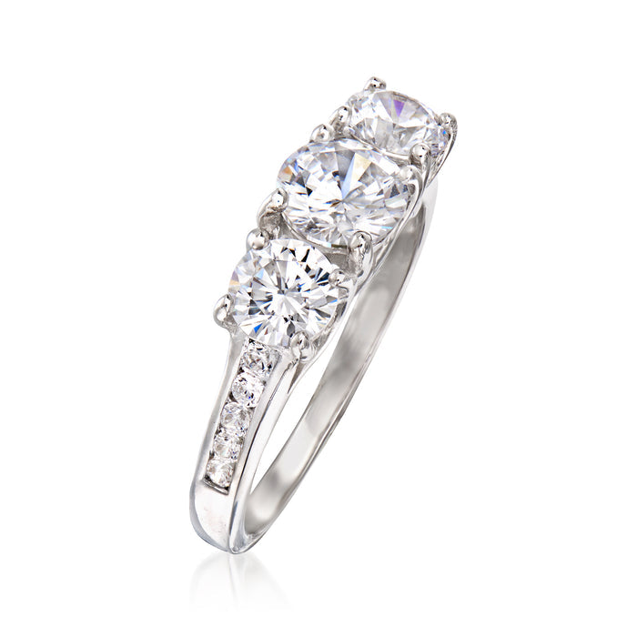 Sterling silver three-stone CZ ring with cushion prongs and sparkling round center stone