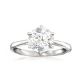 Sterling silver solitaire ring with round moissanite center stone, four prongs