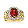 Oval red garnet ring with white zircon halo and filigree in gold over sterling