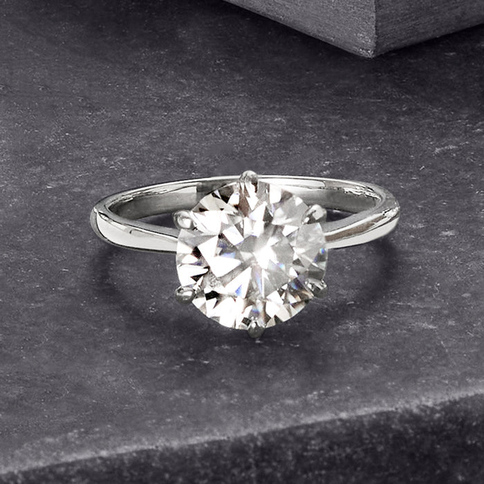 Sterling silver solitaire ring with round moissanite center, angled top view