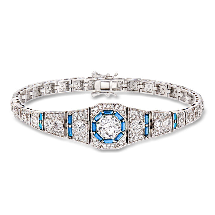 Sterling silver tennis bracelet with blue simulated sapphire center and CZ accents