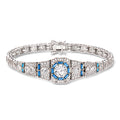 Sterling silver tennis bracelet with blue simulated sapphire center and CZ accents
