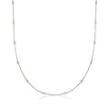 Sterling silver diamond station necklace with bezel-set round stones along a thin chain.