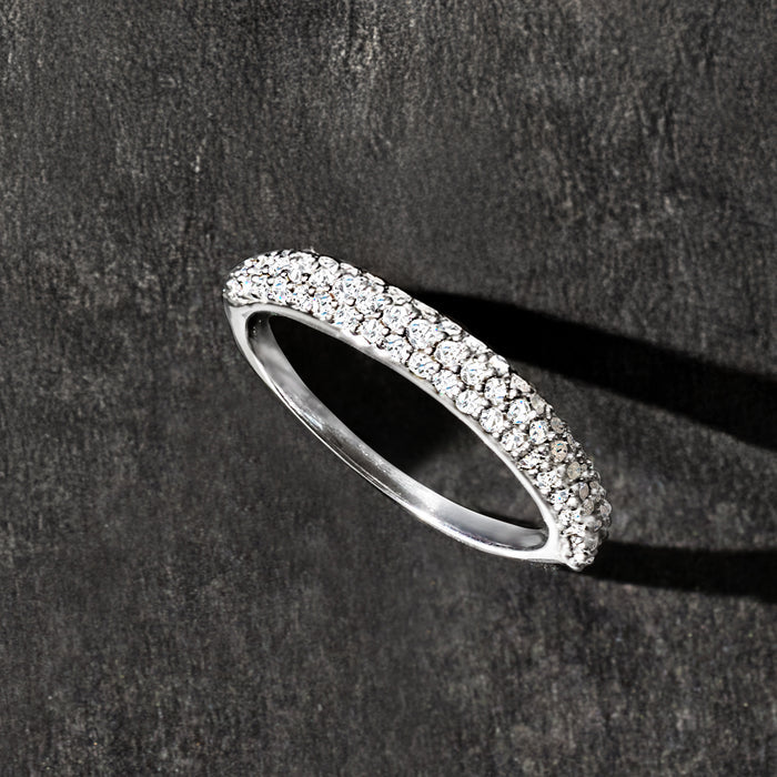 Sterling silver pave diamond ring, profile view; bright stone-set band.