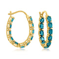 Gold hoop earrings with inside-out London blue topaz accents and hinged posts