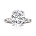 Sterling silver round CZ ring with prong-set center stone and pave side accents