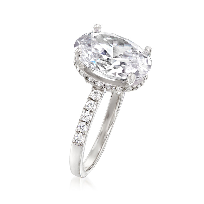 Sterling silver oval CZ ring with prong-set center stone and pave side bands