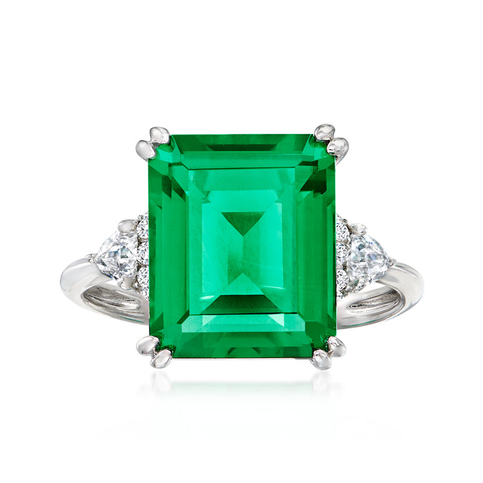 Sterling silver ring with large green emerald-cut center and four prongs, CZ halo