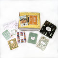 A paperback edition of Winterhouse stands on a yellow OUABC Tween box. In front of the box are 5 themed wrapped gifts labeled with page numbers.