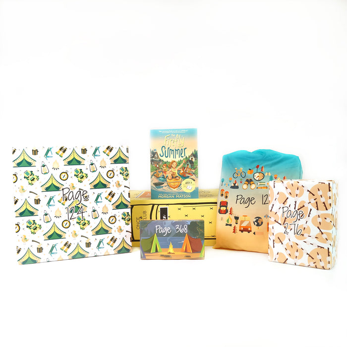 A paperback edition of The Firefly Summer stands on a yellow OUABC box. In front of the box are four themed wrapped gifts labeled with page numbers. Each gift has summer-themed wrapping paper.