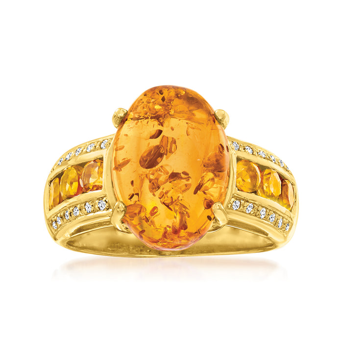 Gold over sterling ring with large oval amber-colored gemstone and diamond-like side stones