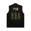 Black sleeveless shirt with gold text on a white background