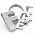 FramePlus silver painted aluminum letters and numbers, arranged in a balanced configuration with different sizes (4-inch and 6-inch) to showcase professional signage solutions