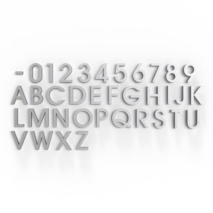 A stylish display of silver painted aluminum letters and numbers in Avant Garde Medium font, arranged for modern branding and high-visibility applications