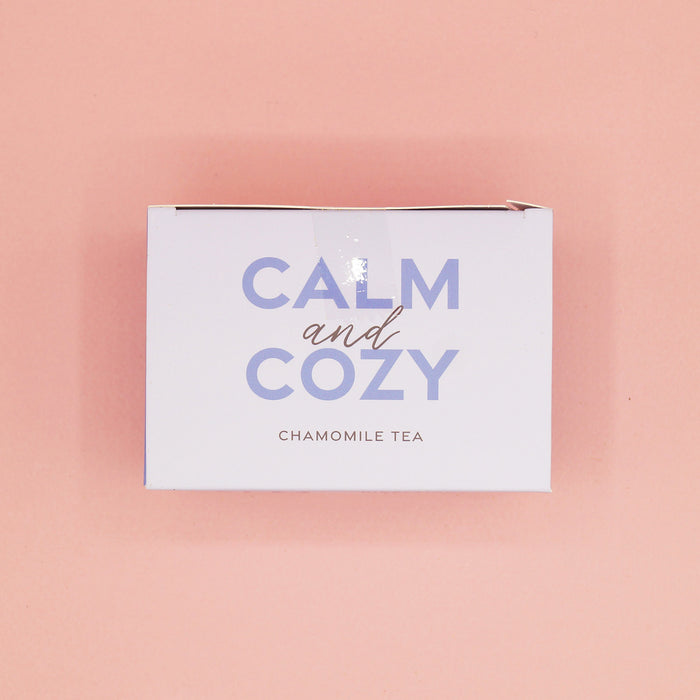 A light purple box labeled Calm and Cozy Chamomile Tea