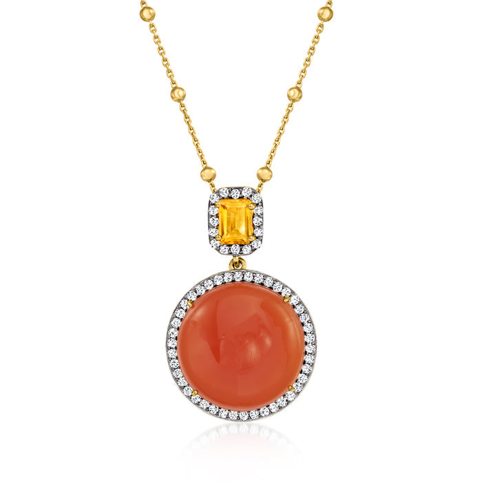 Gold-tone pendant necklace with oval orange gemstone, diamond-like halo and small accents