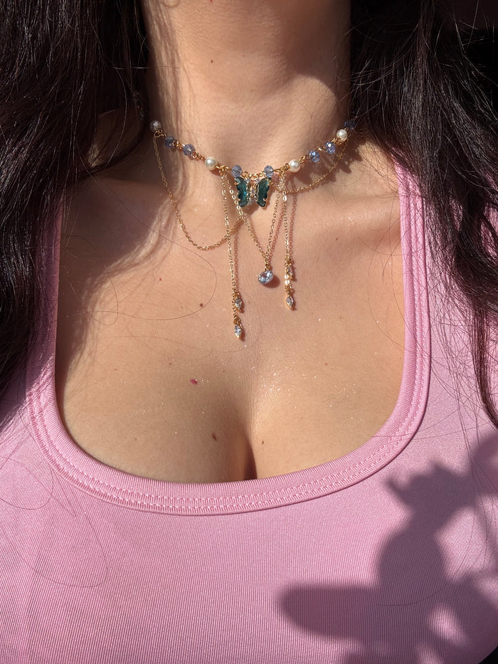 Fairy Silvermist Choker Necklace with gemstones on a person wearing a pink top.