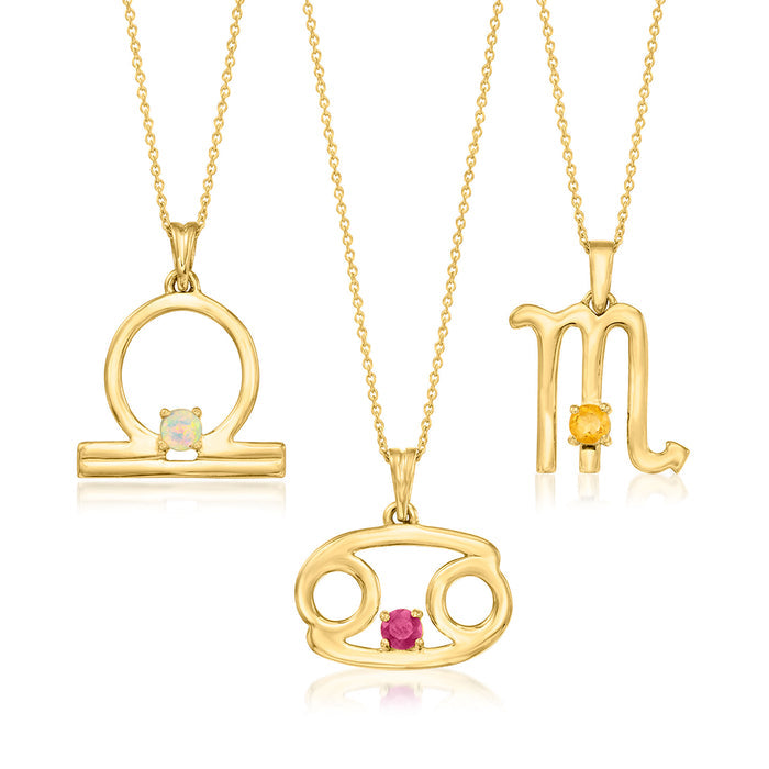 Gemstone zodiac pendant necklace, gold-tone circular symbol with light blue stone