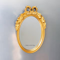 A bright gold mirror with black text at the bottom (on the mirror) that says I Will If You Will.