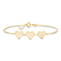 14kt yellow gold heart station bracelet with openwork floral design, three hearts