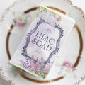 A bar of white soap labeled OUABC Lilac Soap 1oz.