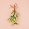 A sprig of faux mistletoe