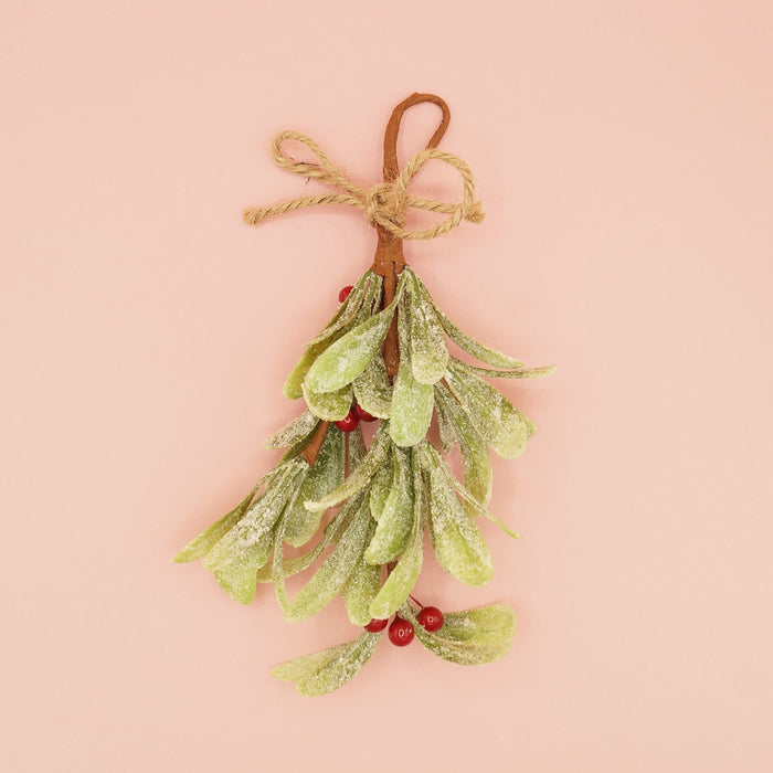 A sprig of faux mistletoe