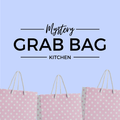 Mystery Grab Bag - Kitchen. There are pink polkadot shopping bags along the bottom of the image.