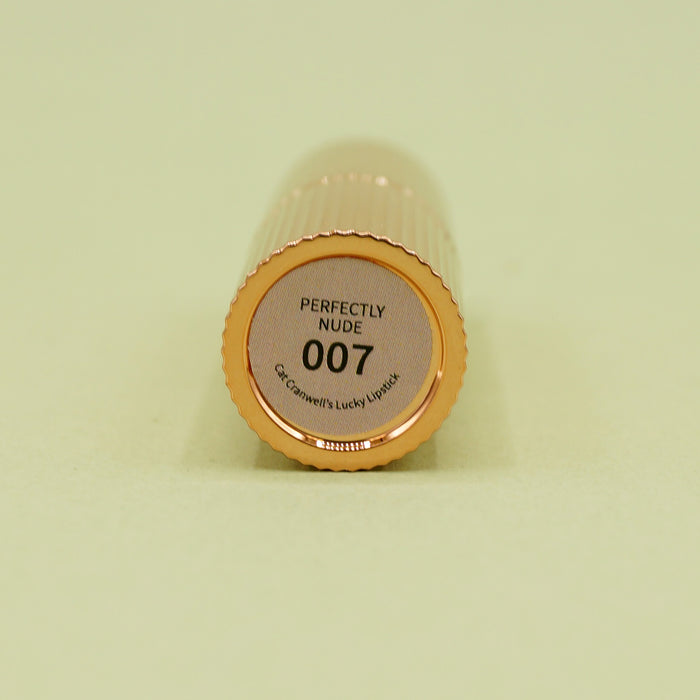 the bottom of a lipstick tube laying on its side that says Perfectly Nude 007