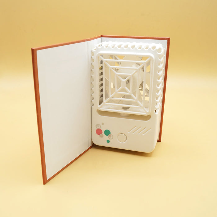 a fan shaped like the book The Iliad sits open against a yellow background