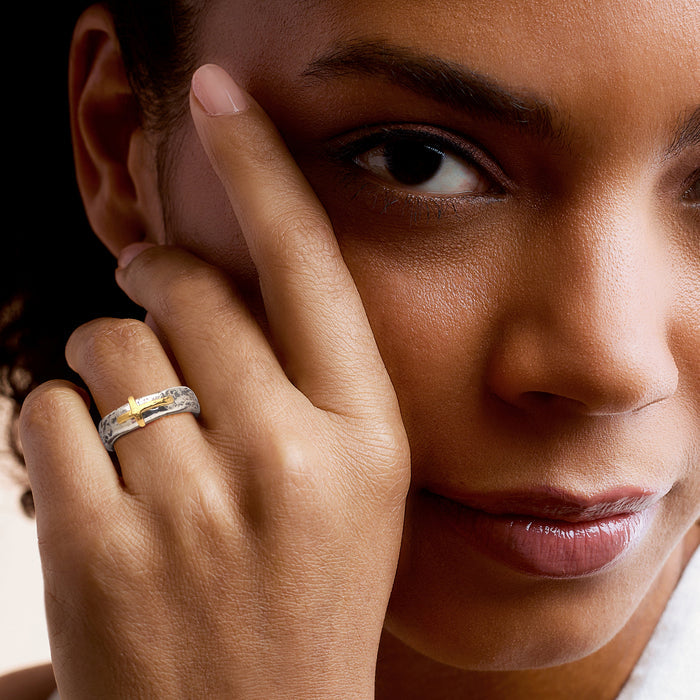 Sideways cross ring on finger: sterling silver band with yellow gold cross