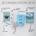 The Graduation Box: A copy of Today Tonight Tomorrow by Rachel Lynn Solomon, a personalized card, a confetti popper, a disposable camera, a bookmark, a mug, and a letter to my future self kit.