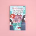 Book cover of 'The Primrose Murder Society' by Stacy Hackney on a pink background