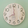 a wooden wall clock with the quote "Objects are stories in physical form"