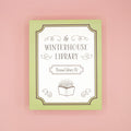 The Winterhouse Library Personal Library Kit custom box on a pink background