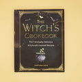 a hardcover edition of The Witch's Cookbook - 50 Wickedly Delicious Witchcraft-Inspired Recipes by Fortuna Noir