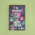 Book cover of 'The Wondrous Life and Loves of Nella Carter' by Brionni Nwosu on a green background