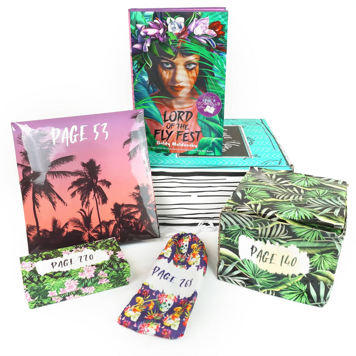 A hardcover edition of Lord of the Fly Fest stands on a green Once Upon a Book Club box. In front of the box are a pink folder, green box, drawstring bag, and green box. All bags and boxes are labeled with page numbers.