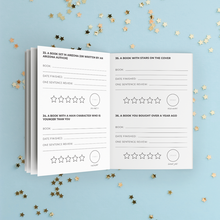 An open sneak peek of some of the challenges inside this year's Reading Challenge booklet including printed review prompts and star rating circles, photographed on a light blue background with scattered gold star confetti.