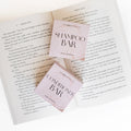An open book with two square boxes on the pages - Shampoo Bar and Conditioner Bar.