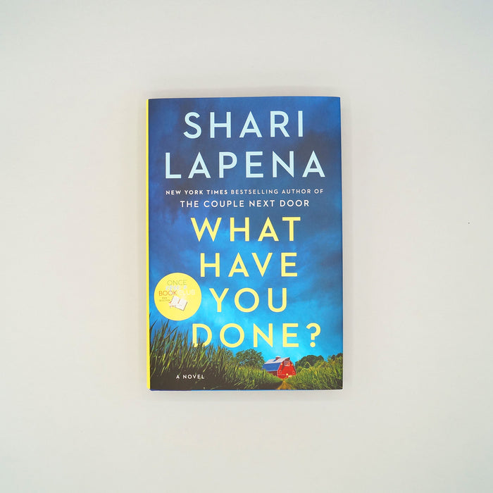 A hardcover copy of What Have You Done? by Shari Lapena sits on a white background.