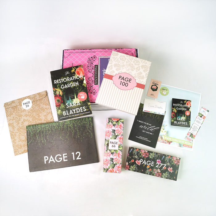 A paperback copy of The Restoration Garden by Sara Blaydes surrounded by wrapped gifts labeled with page numbers and paper items.