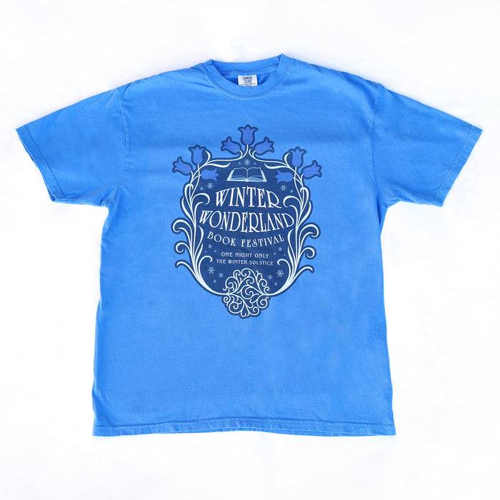 Blue t-shirt with 'Winter Wonderland Book Festival' design on a white background